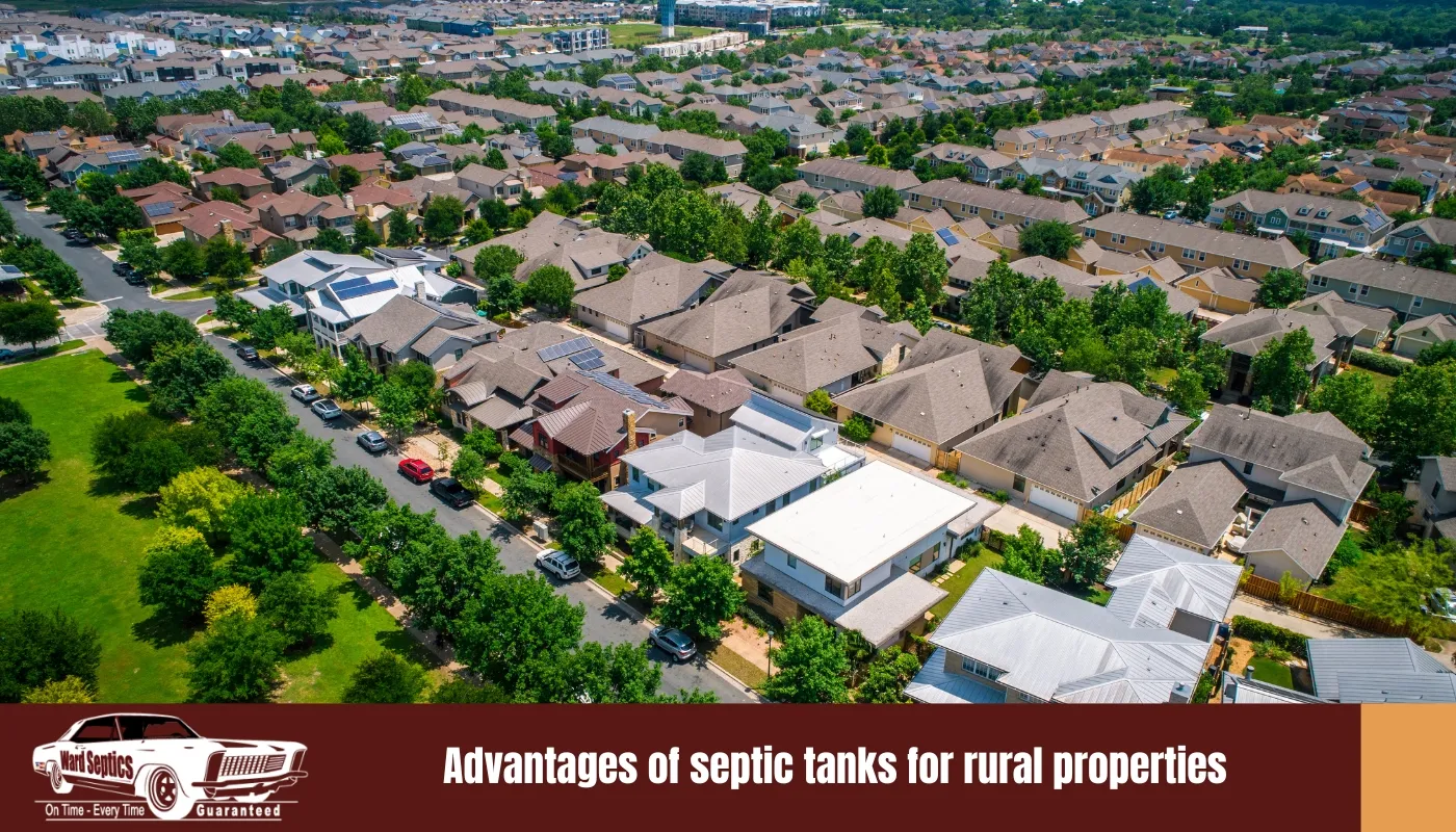 An elevated aerial view of a densely packed suburban neighborhood with many modern houses and green trees