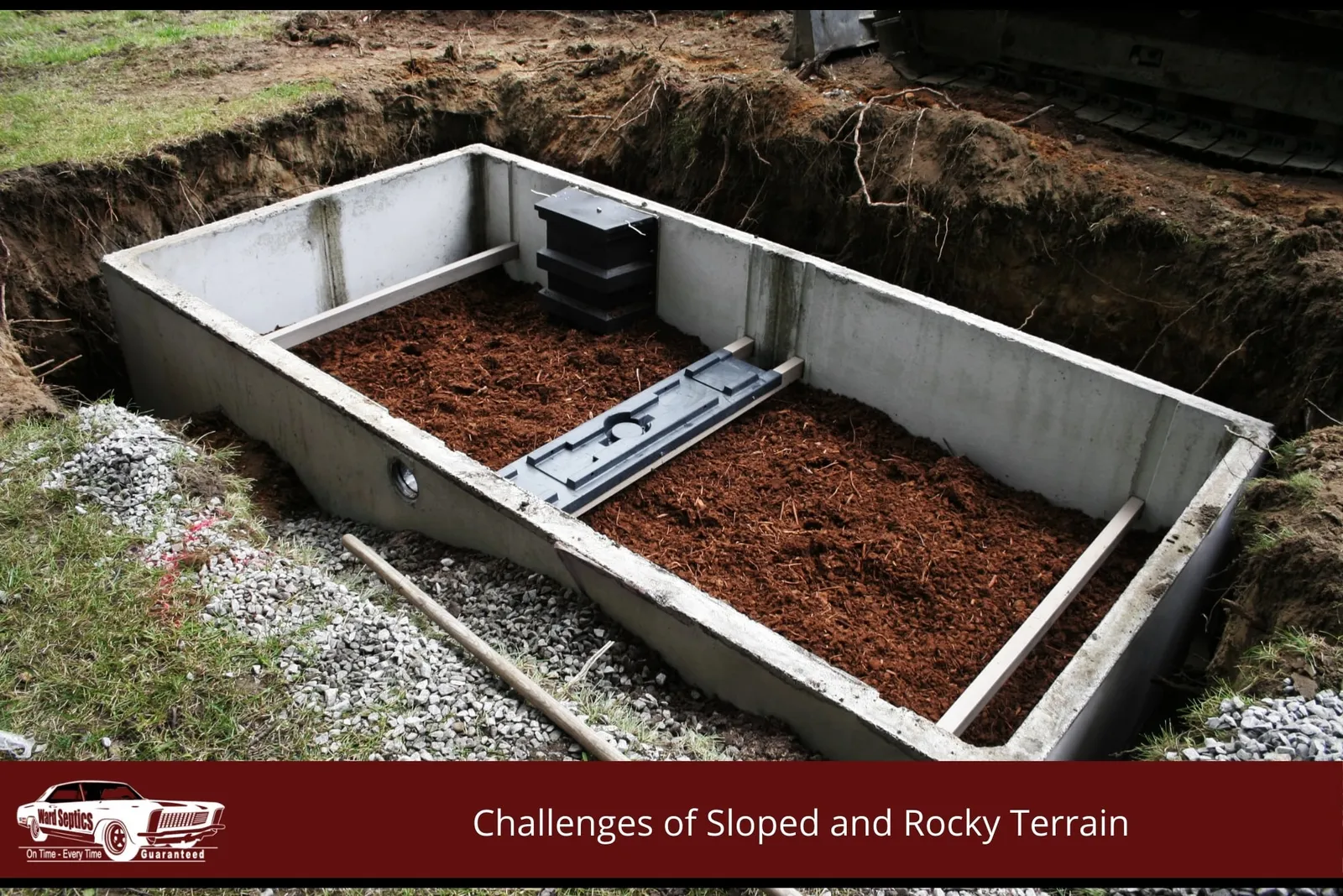 A large rectangular concrete septic system filter tank installed in an excavated dirt pit.
