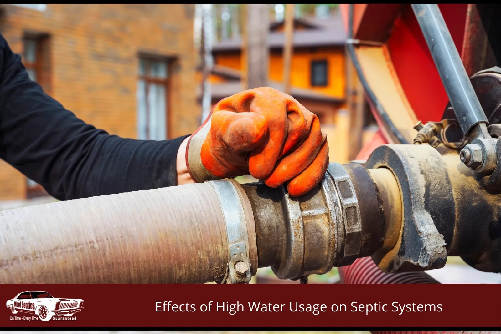 A gloved hand tightens a large coupling connecting two heavy-duty hoses.