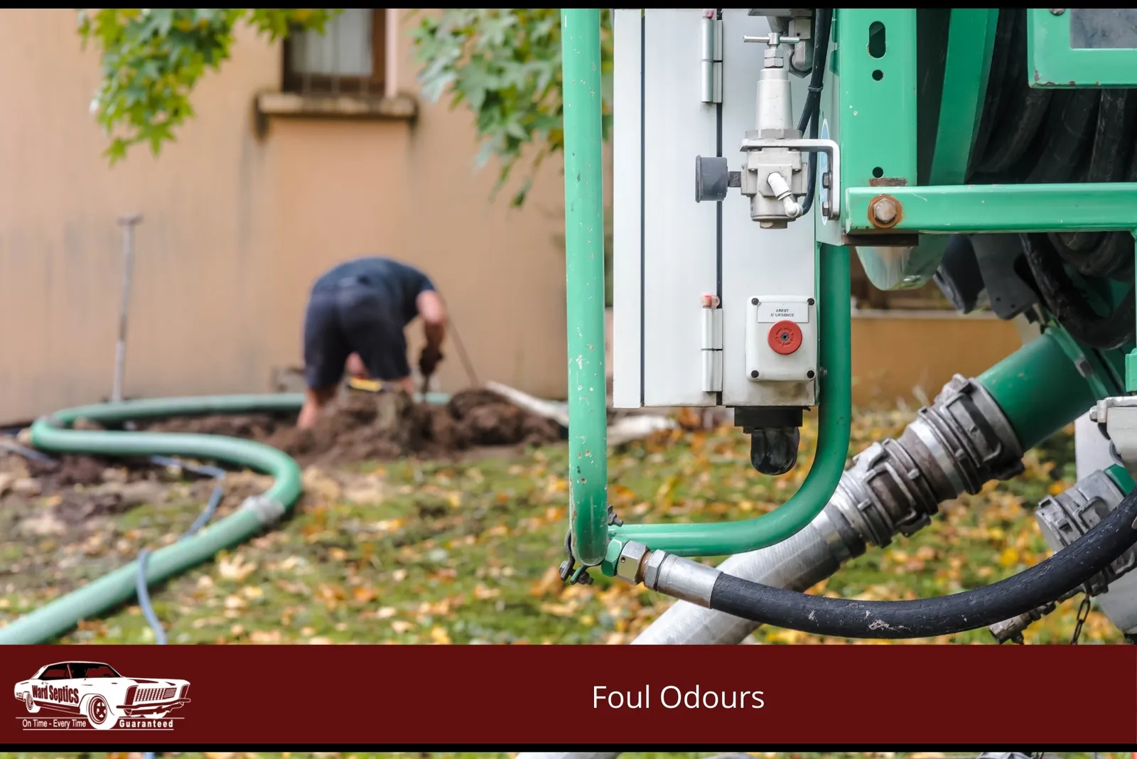 A close-up of green industrial pumping equipment with a technician working in the background to excavate a septic area.