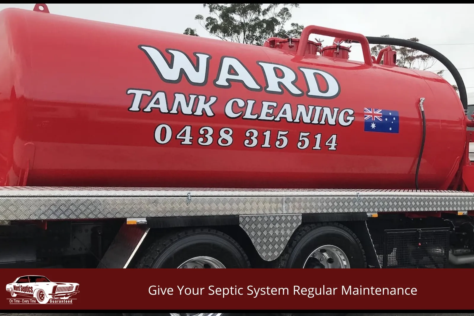 A large, bright red liquid waste tank mounted on a service truck bed.