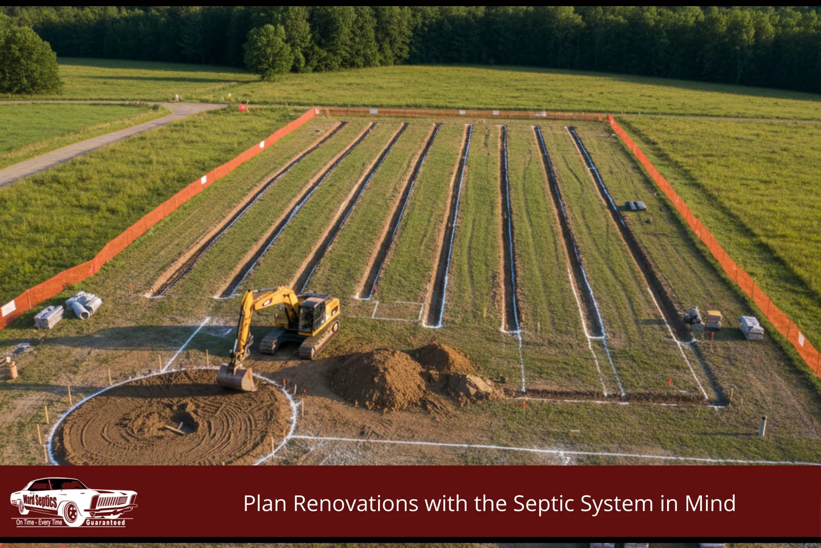 A large commercial septic drainfield under construction in a grassy field.