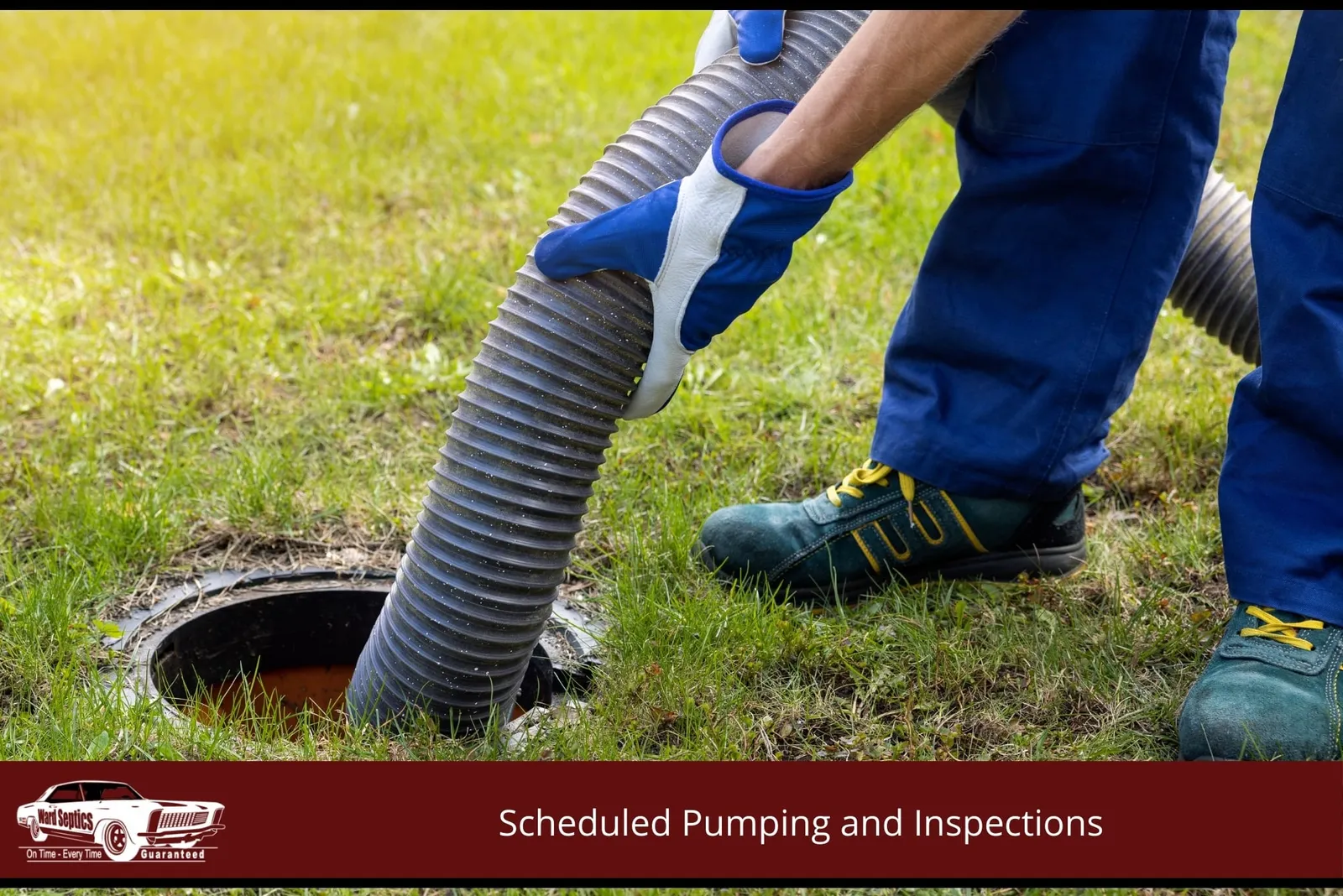 A technician wearing blue-and-white work gloves guiding a large corrugated vacuum hose into an open underground septic tank access hole on a green lawn.
