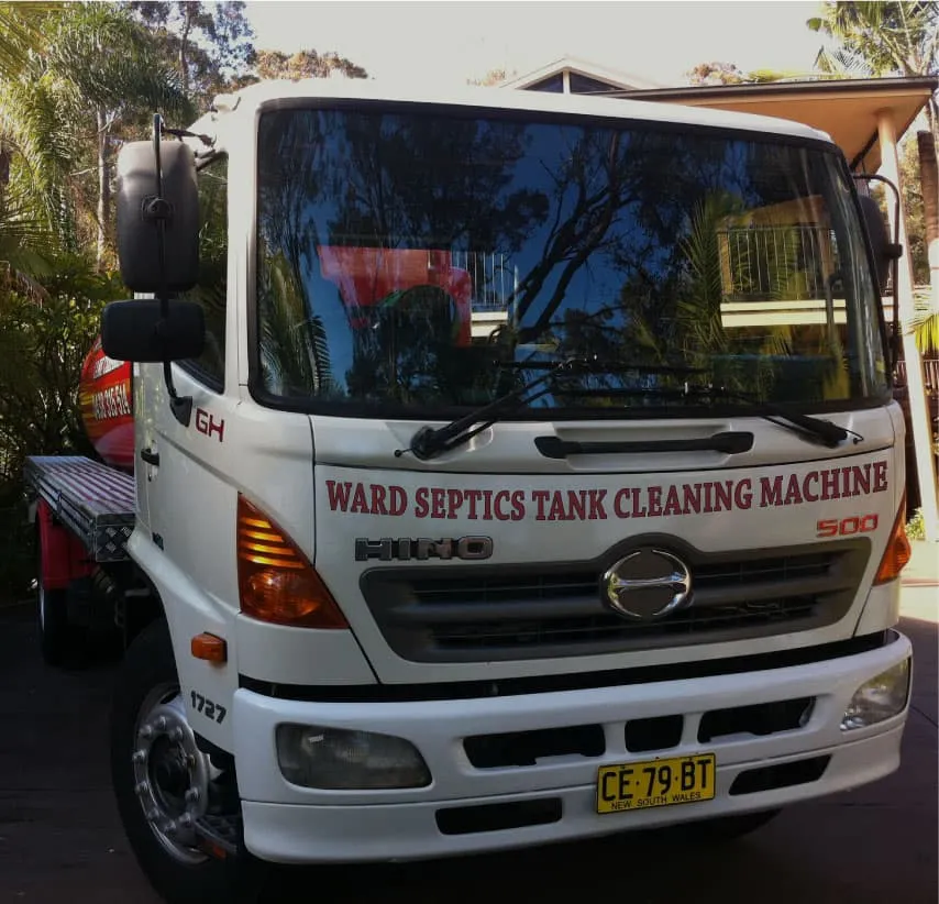 A front view of a white Hino 500 service truck with 