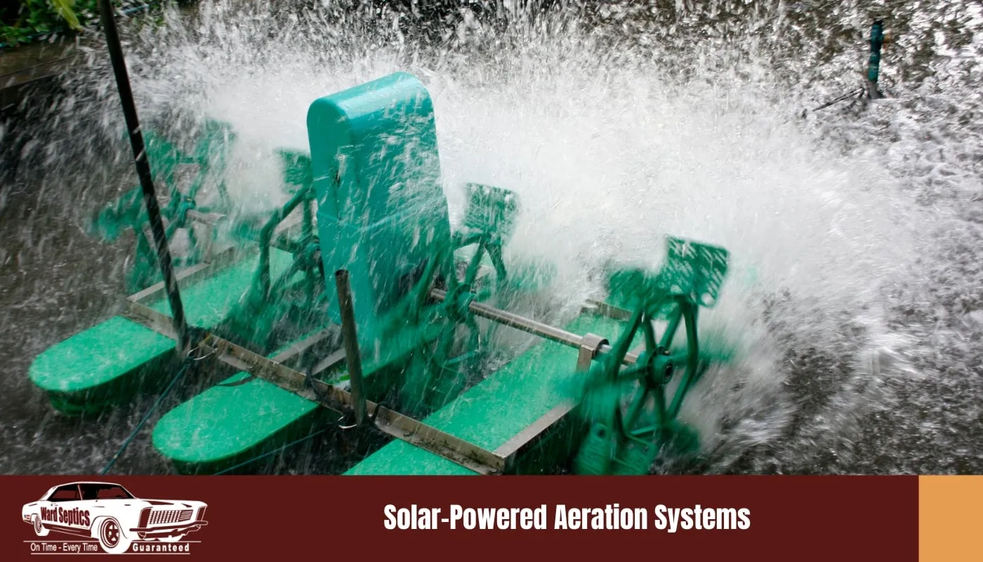 A green paddlewheel aerator splashes water in a pond or tank