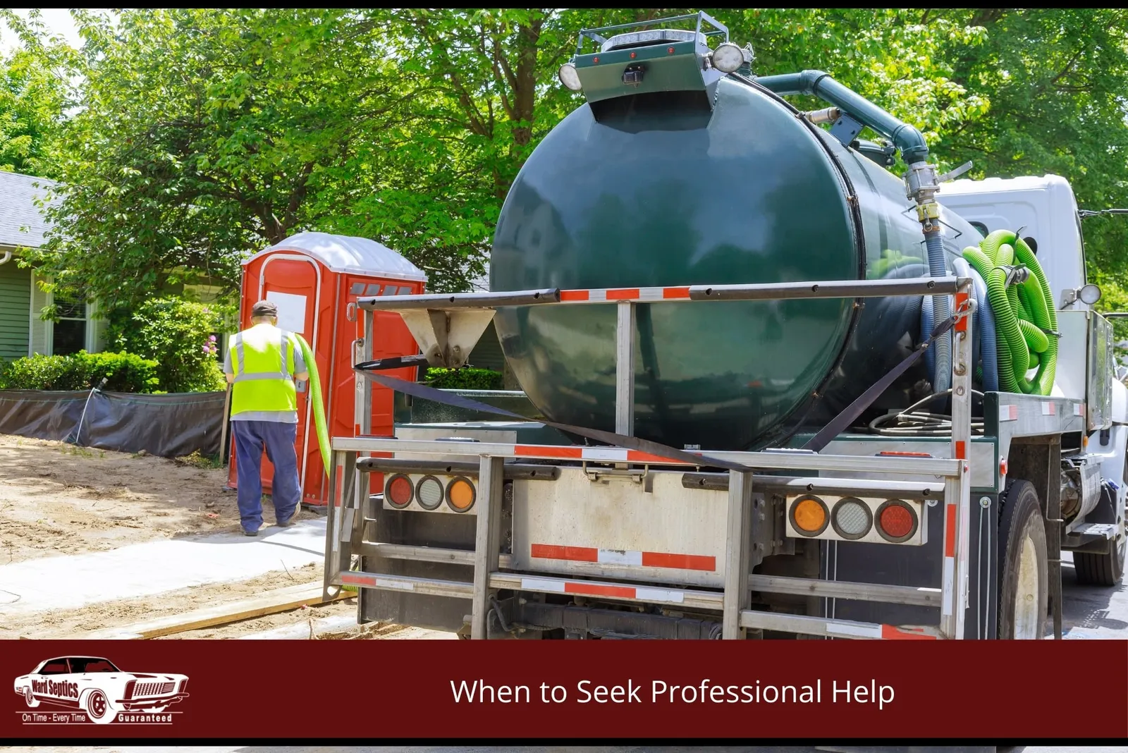 A man holding a hose from the septic truck
