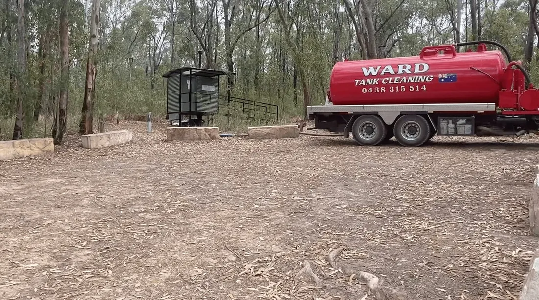 The Ward truck pumping out the National Parks campground facilities among the gums at Mogo camp site, Bucketty