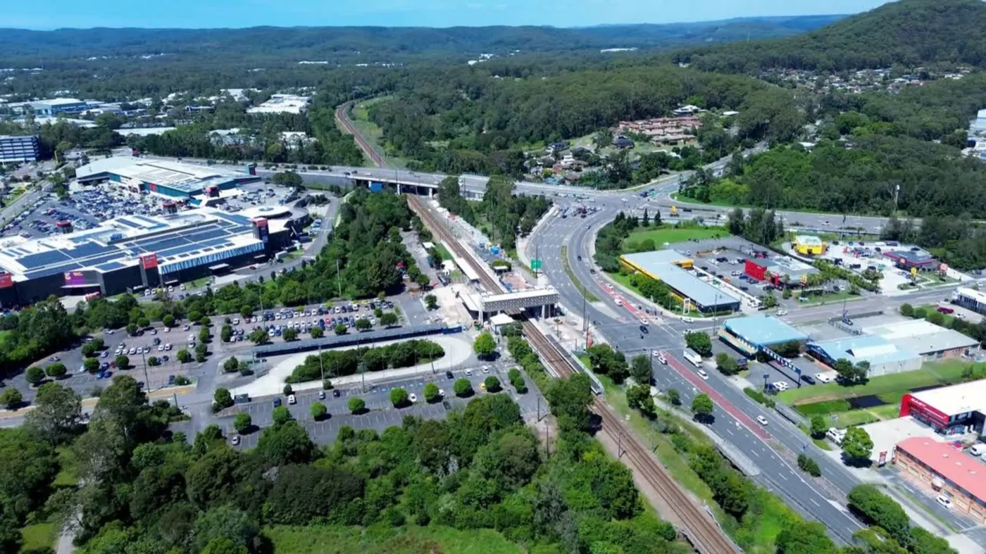Aerial view over the Tuggerah interchange with Westfield, the M1 and bushland ridges behind