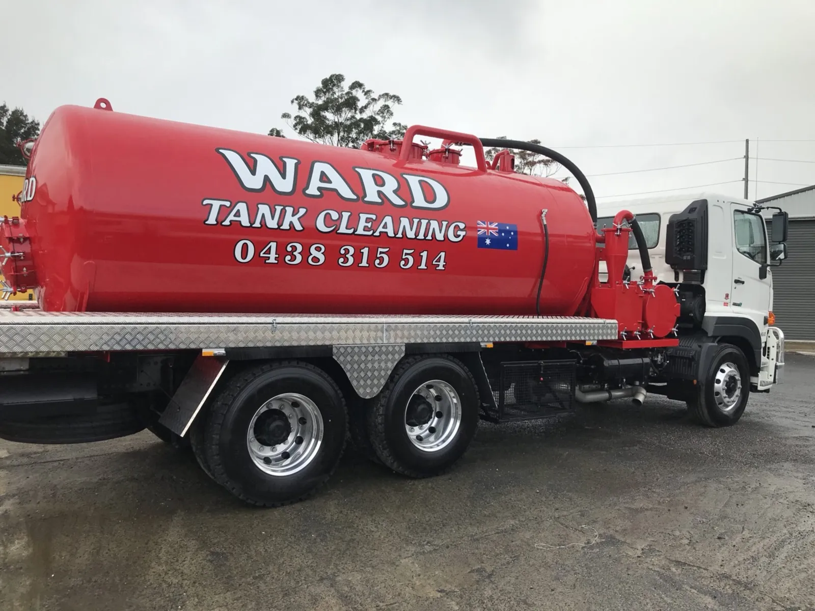 Rear quarter of the red Ward vacuum tank with the Australian flag on the barrel