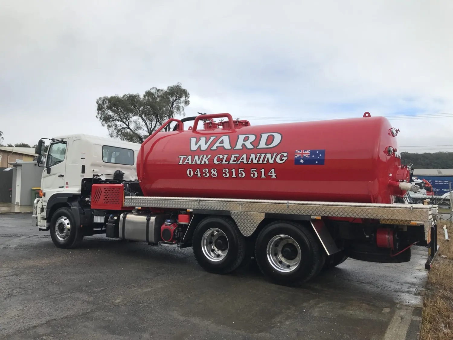 The red Ward Tank Cleaning vacuum tanker parked up, ready for the Tuggerah and Wyong run