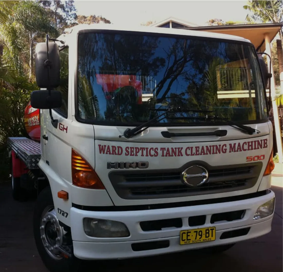 The red Ward Tank Cleaning truck parked kerbside, ready for a job