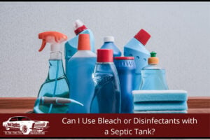 Household bleach and disinfectant spray bottles on a kitchen bench — common cleaning products that can affect a septic tank when overused