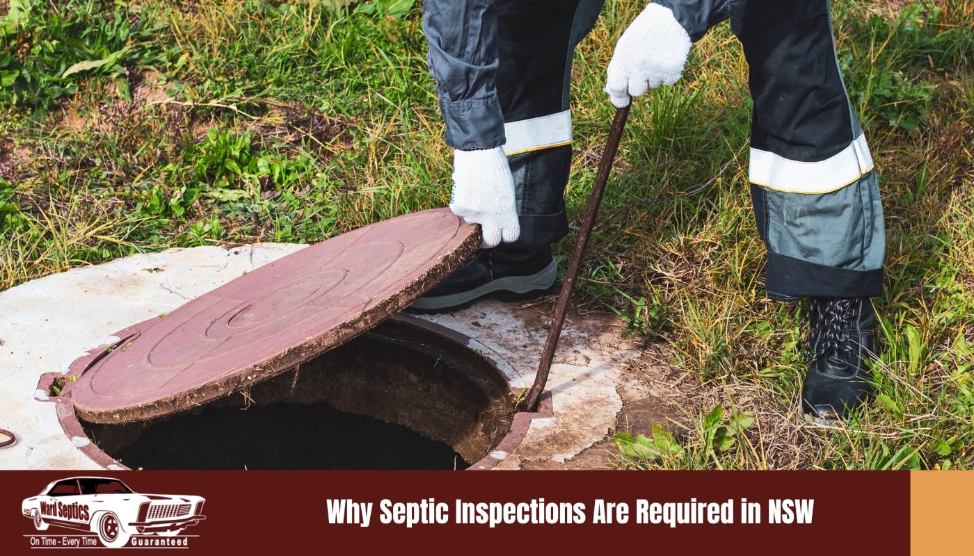 A septic tank technician lifting the access lid on a concrete septic tank buried in the ground on a rural NSW property, preparing to carry out a routine inspection of the tank interior.